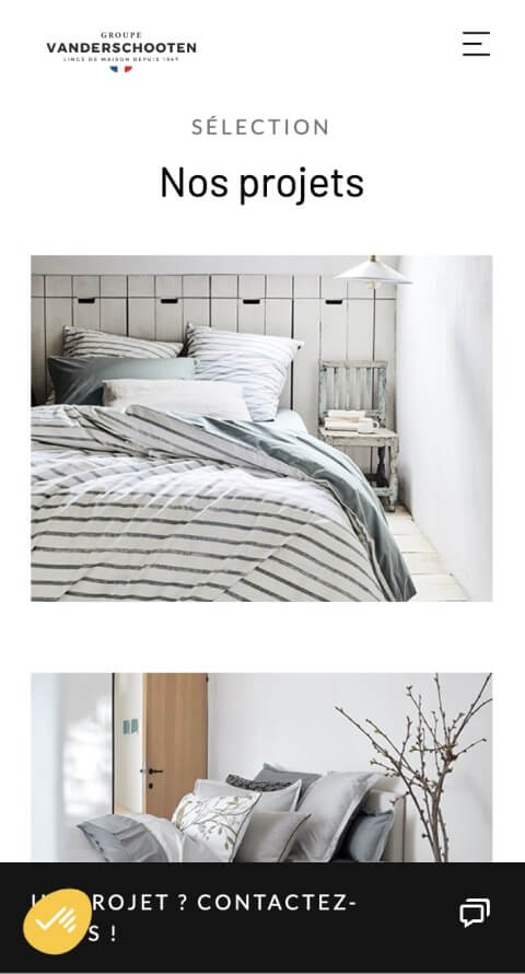 Capture d'écran du site Vandershooten, photo d'un lit avec des draps colorés gris et blancs